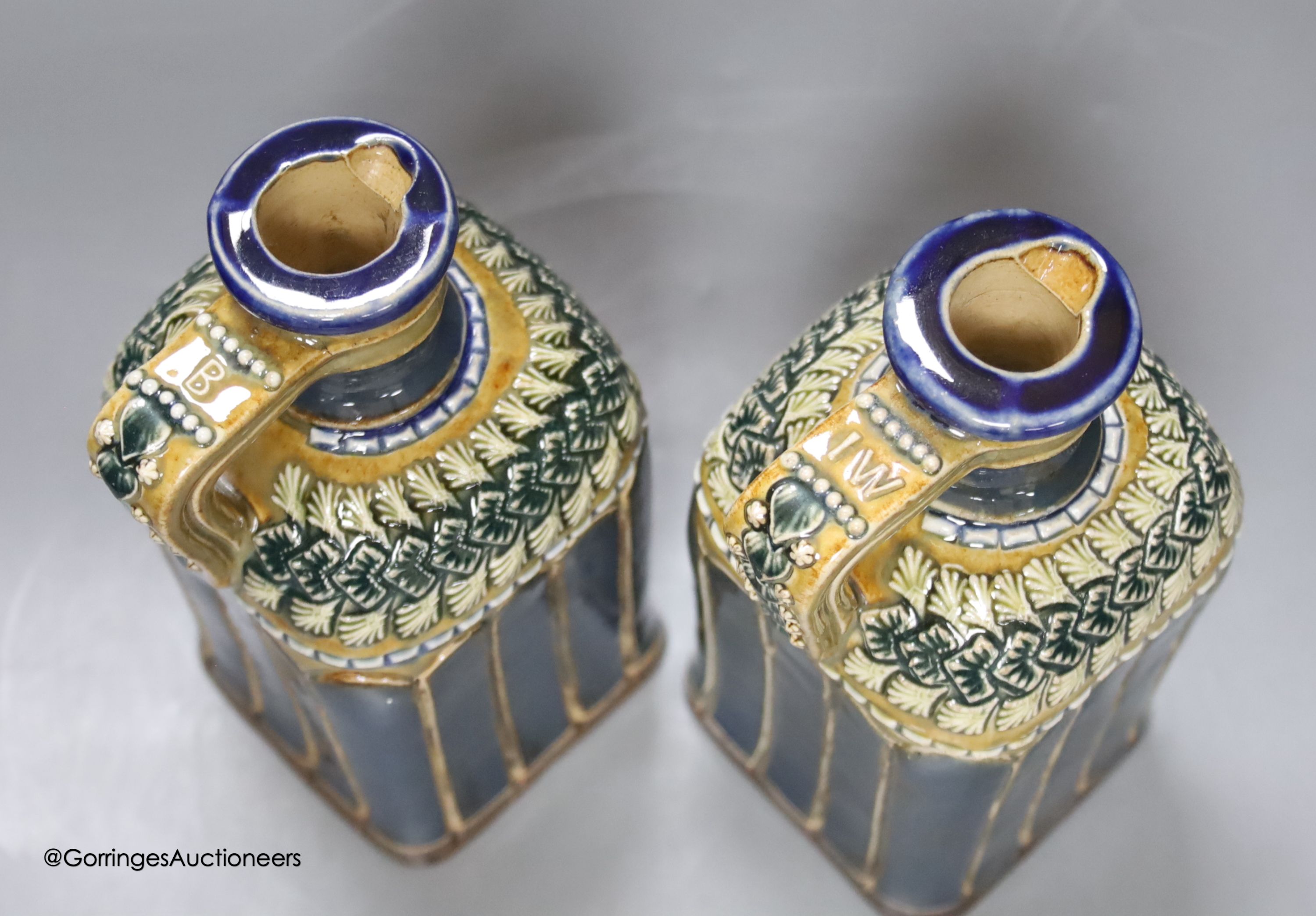 A pair of Doulton spirit decanters, 20cm high.